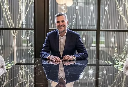 VB Pro advisor seated at a boardroom table in a modern commercial property office